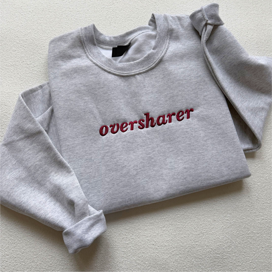 Oversharer — Embroidered Gildan Sweatshirt
