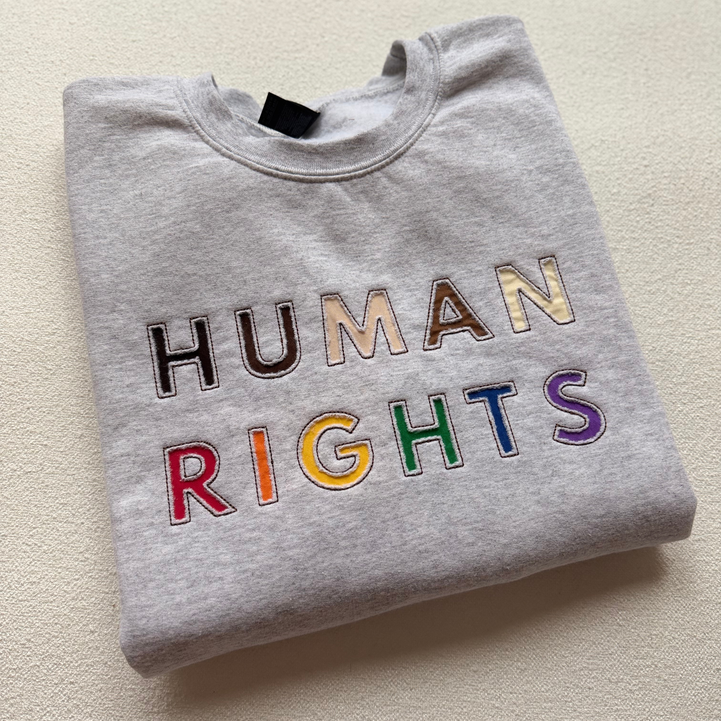 HUMAN RIGHTS — Reverse Applique Embroidered Gildan Sweatshirt